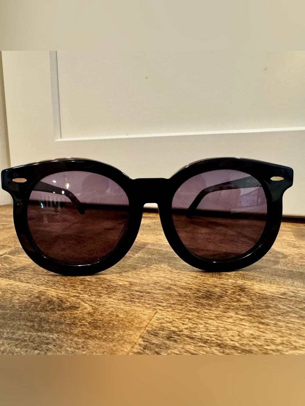 Karen Walker Black Round Sunglasses with Gold Detail and Purple Tint Lenses
